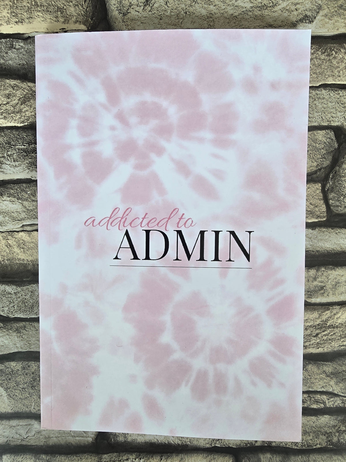 A5 pink tie dye notebook with glossy cover and lined pages, perfect for journaling or stationery lovers.