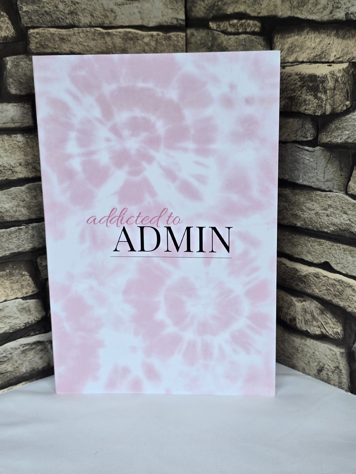 A5 pink tie dye notebook with glossy cover and lined pages, perfect for journaling or stationery lovers.